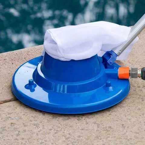 Pool leaf vacuum in action, efficiently sucking up leaves & debris from a swimming pool with powerful cleaning.