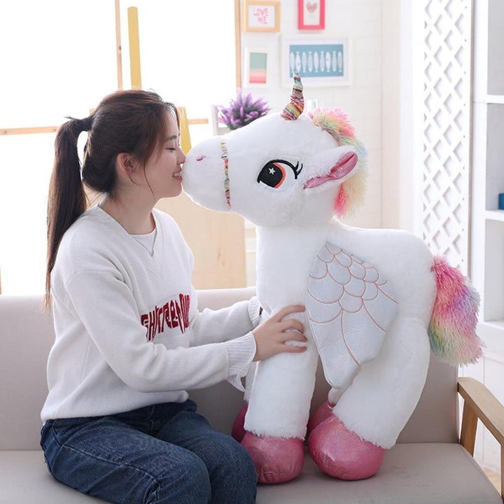Large soft unicorn plush toy for kids, a cuddly magical creature perfect for playtime.