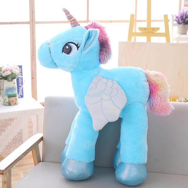 Close-up of a fluffy pink unicorn stuffed animal, highlighting its soft texture for children.