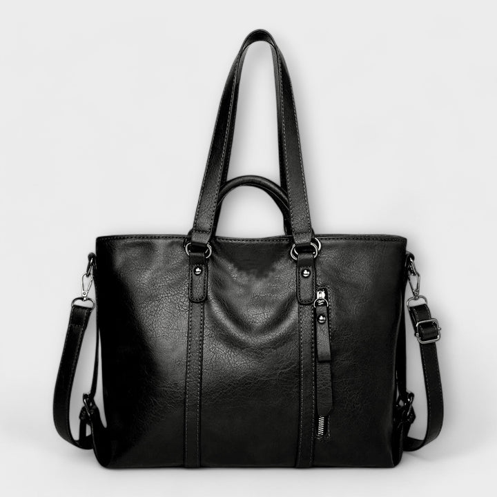 Spacious women's leather carryall tote, a practical large capacity shoulder bag.
