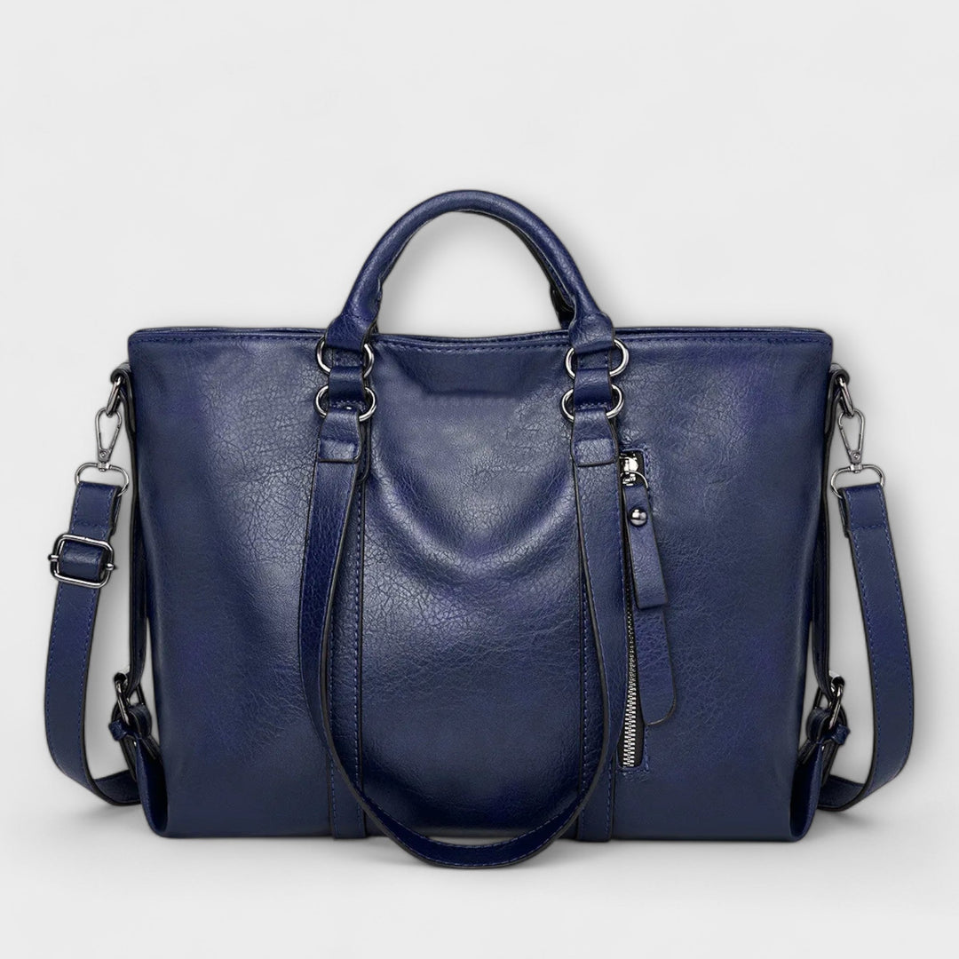 Women's spacious leather carryall tote, an essential large capacity shoulder bag for daily needs.