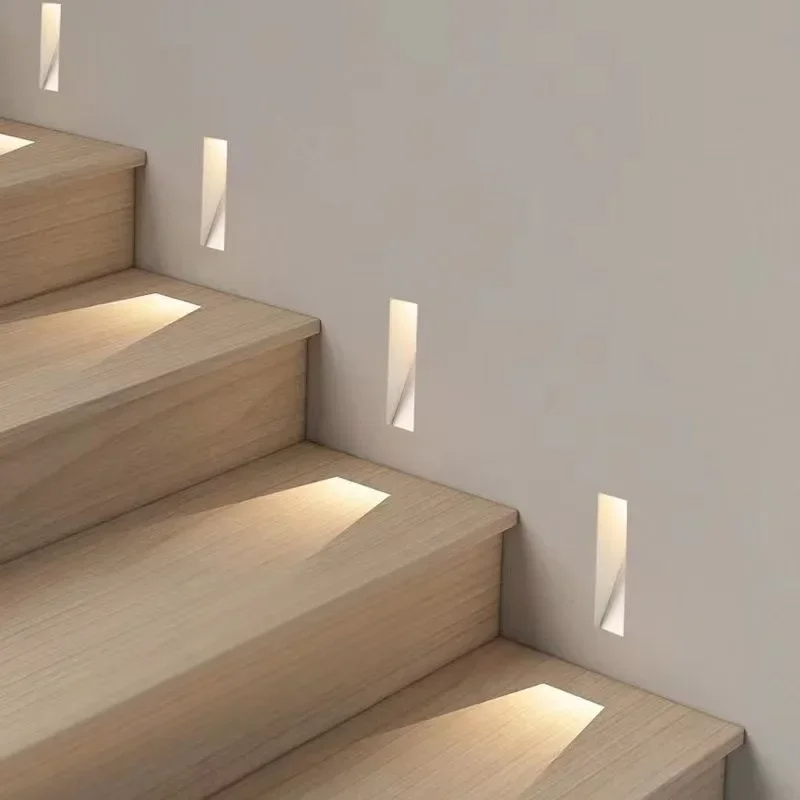 Modern LED recessed wall fixture, ideal for stairway and hallway ambient lighting.