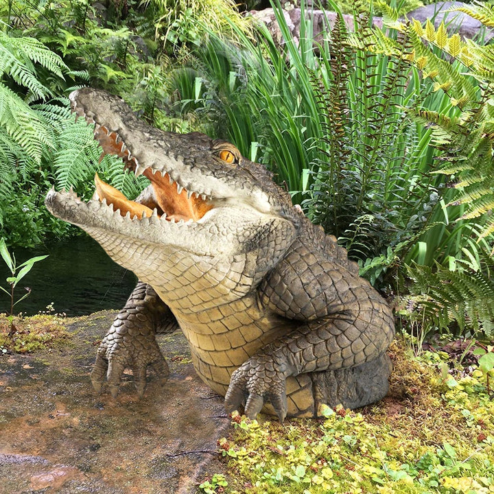 Lifelike 19-inch resin crocodile garden statue for outdoor decor. Perfect lawn or poolside accent.