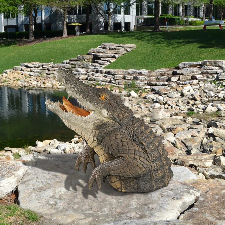 Unisex 19-inch lifelike crocodile garden statue, a striking resin sculpture for outdoor patio decor.