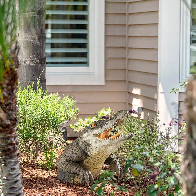 Side view of a realistic 19-inch crocodile garden statue, a unique outdoor resin sculpture.