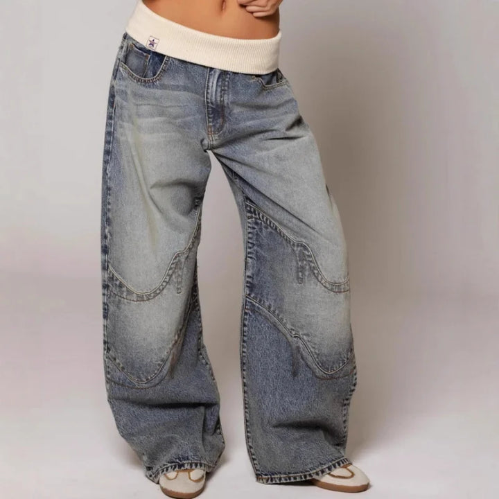 Women's light blue Y2K baggy wide leg jeans, embracing retro fashion & a comfortable oversized fit.