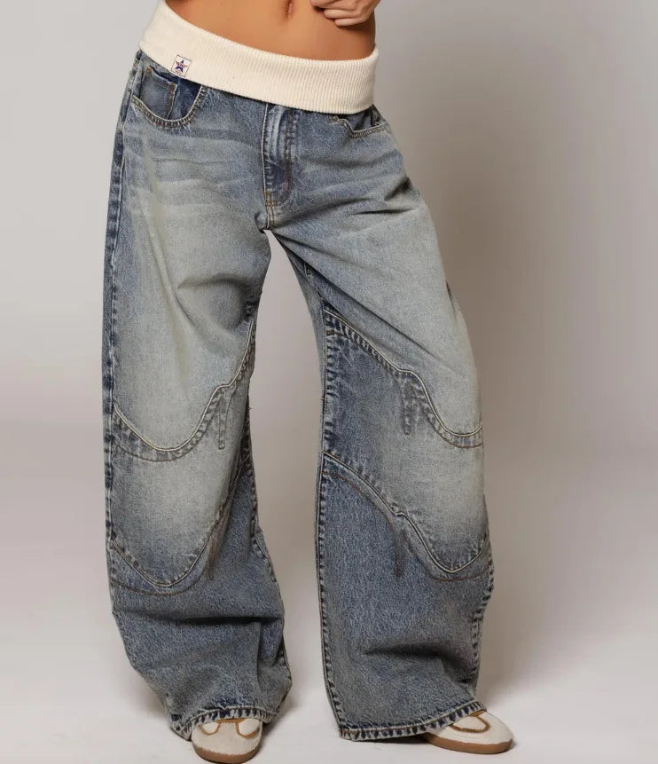 Stylish women's Y2K baggy wide leg jeans in light blue, featuring a ribbed waist for ultimate comfort.