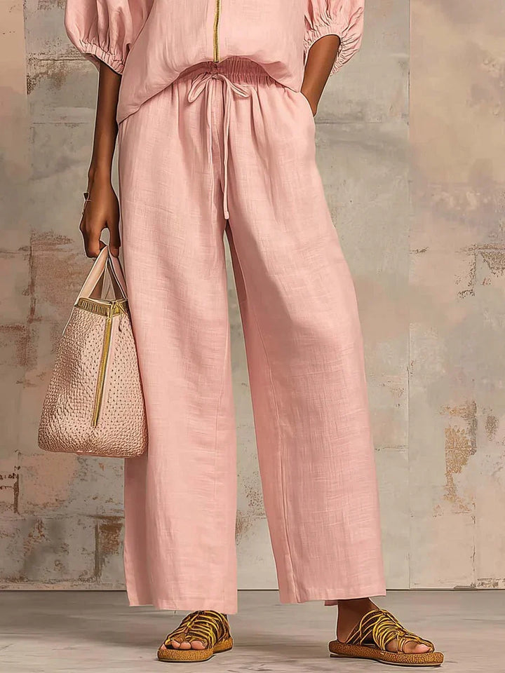 Chic women's relaxed button-up shirt and wide-leg trousers two-piece set. Perfect for everyday casual comfort.
