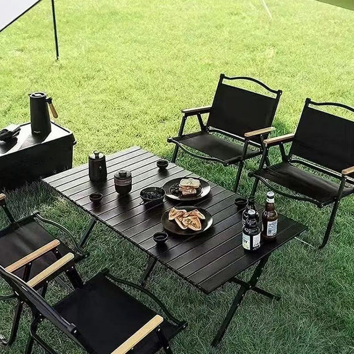 Lightweight aluminum folding camping table for outdoor adventures & picnics. Portable travel gear.