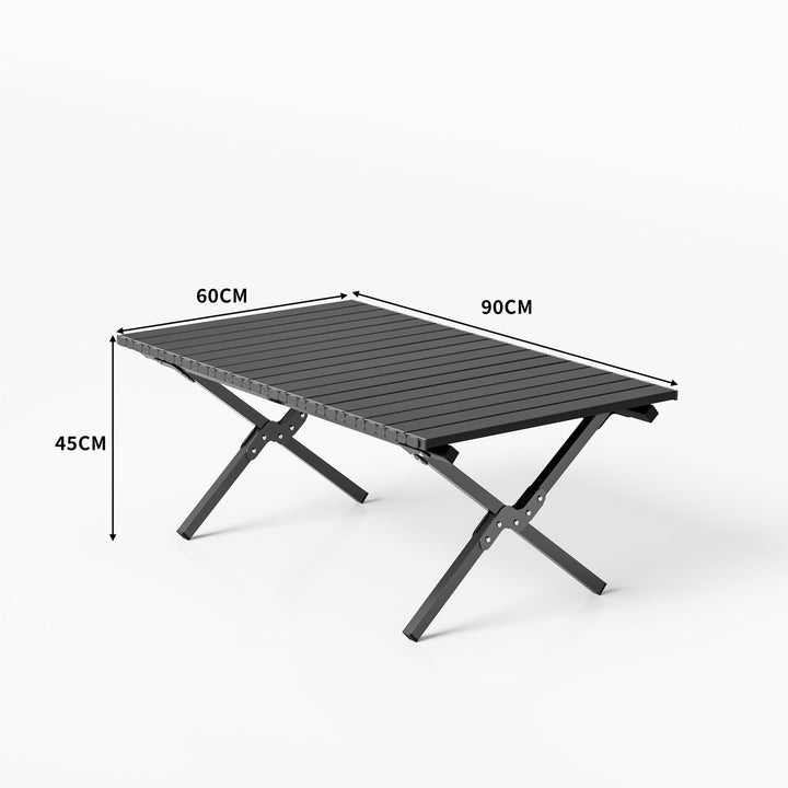 Aluminum folding table in a natural outdoor setting, perfect for camping, picnics, and backyard use.