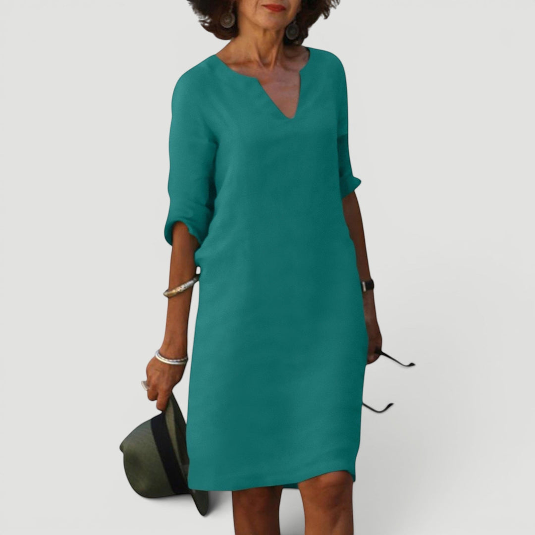 Lightweight women's V-neck 3/4 sleeve midi dress. Ideal for a comfortable, versatile casual look.