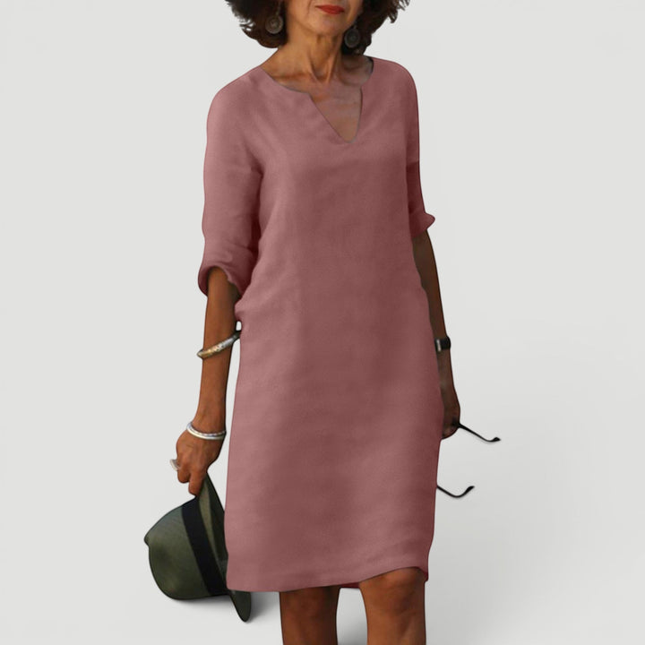 Timeless women's V-neck 3/4 sleeve midi dress. Versatile, lightweight, perfect for casual elegance.