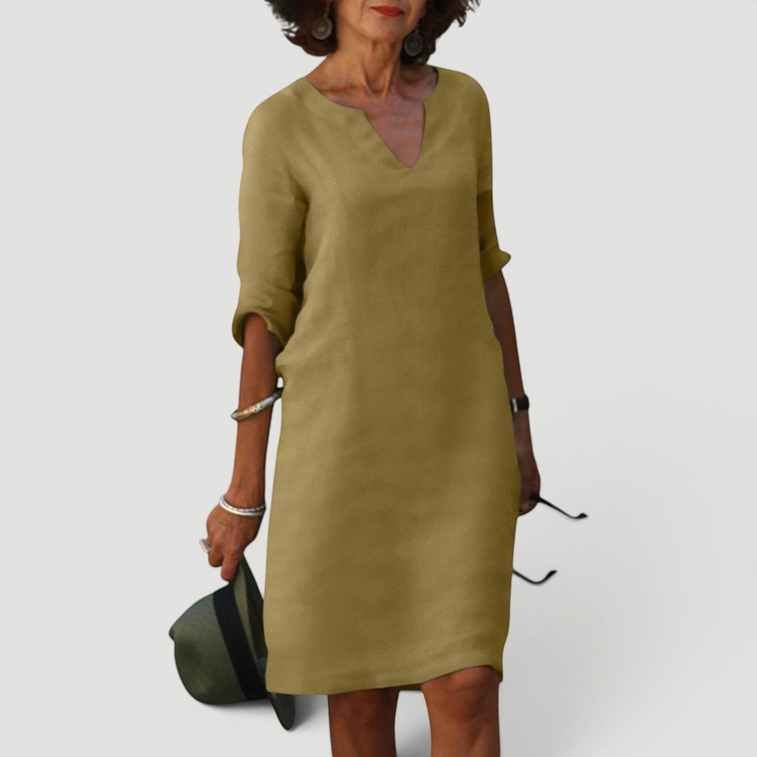 Comfortable V-neck midi dress for women, 3/4 sleeves. Lightweight, elegant for versatile styling.