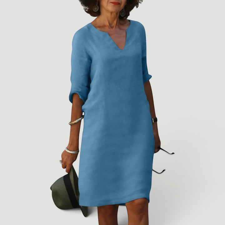 Women's comfortable V-neck 3/4 sleeve midi dress. Elegant shift style for timeless fashion.