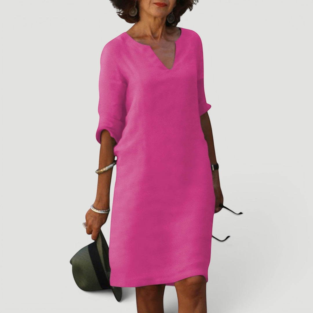 Timeless women's V-neck 3/4 sleeve midi dress. Lightweight and versatile for elegant casual wear.
