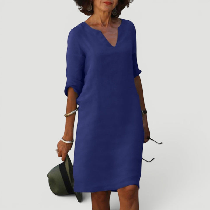 Comfortable women's shift midi dress featuring a V-neck and 3/4 sleeves. Elegant and lightweight.