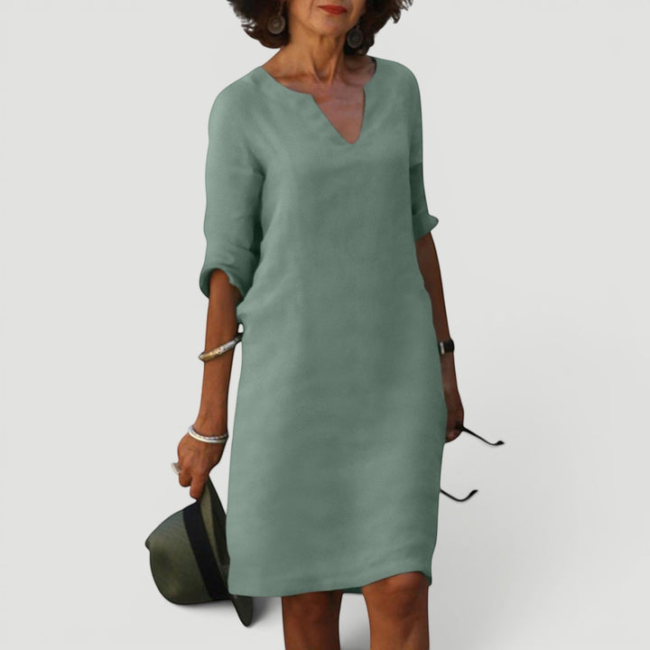 Women's elegant V-neck midi dress with 3/4 sleeves. Lightweight, comfortable, timeless fashion.