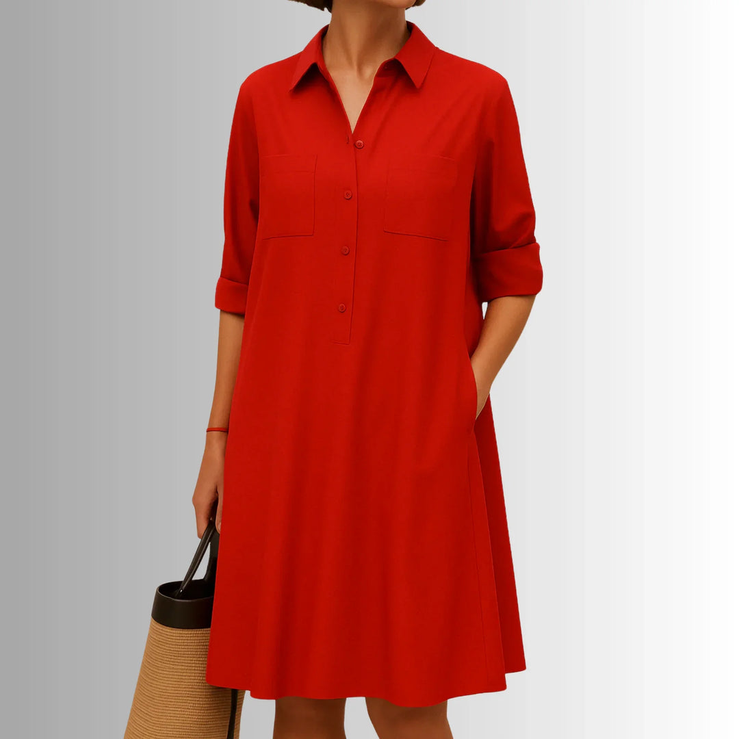 Women's collared A-line mini shirt dress with 3/4-sleeves and button placket. Lightweight & versatile for summer.