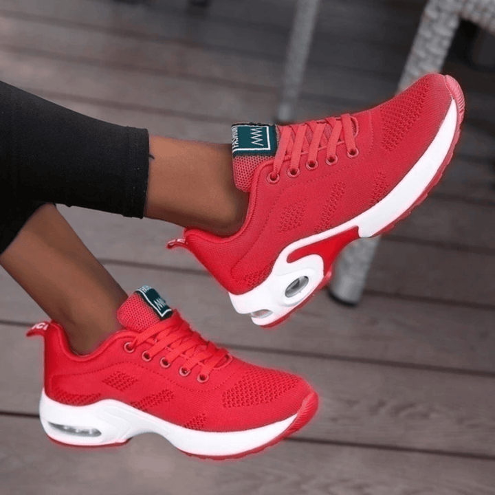 Women's cushioned athletic running shoes, providing supportive comfort for runs and active walking.