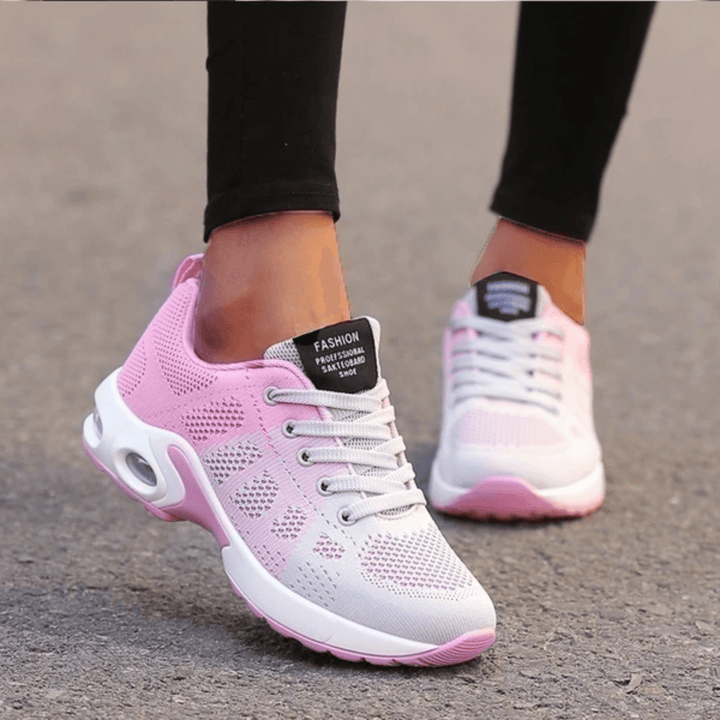 Supportive women's athletic shoes, lightweight design ideal for running, walking, and active lifestyles.