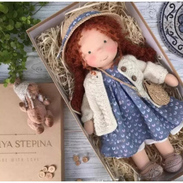 The gentle expression of the Luna Waldorf handmade plush doll.