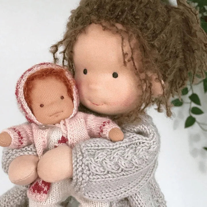 Luna Waldorf handmade plush doll showcasing its soft cotton material.