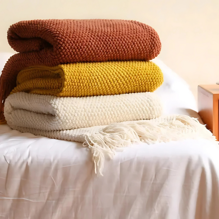 Ultra-soft, warm merino-style throw blanket, perfect for snuggling. Luxury acrylic with elegant tassels.