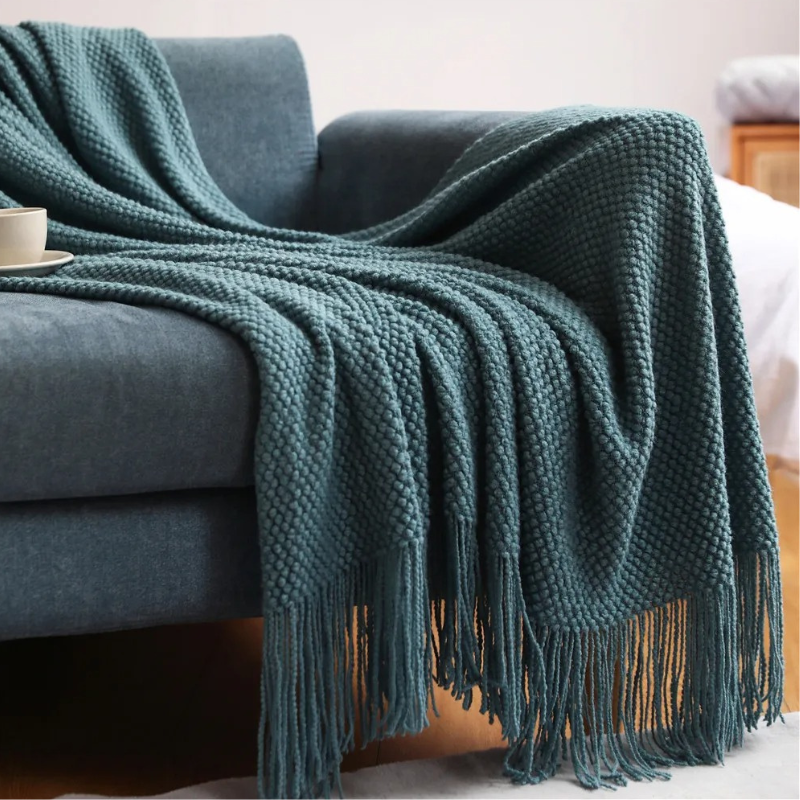 Machine washable merino-style acrylic throw blanket with tassels. Soft, warm, and easy-care home decor.