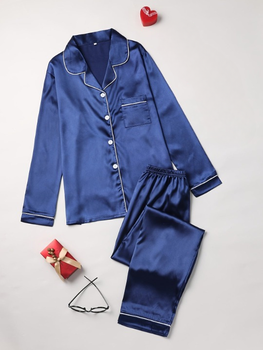 Women's luxurious satin pyjama set. Soft, comfortable two-piece sleepwear with a silky feel for relaxing nights.