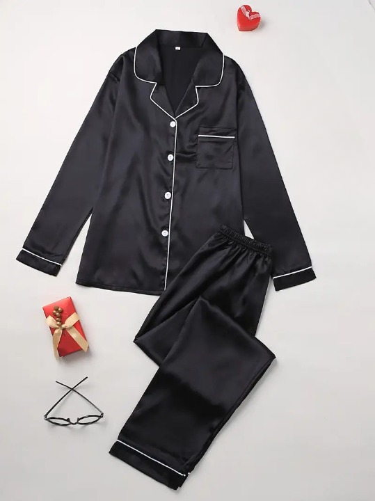 Ladies' elegant satin pyjama set with soft shine. Comfortable two-piece loungewear for luxurious home wear.