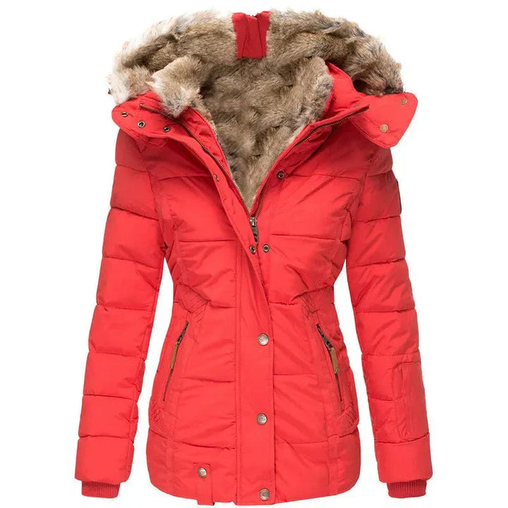 Elegant women's luxury puffer jacket for winter. A warm, stylish insulated coat with a faux fur hood.