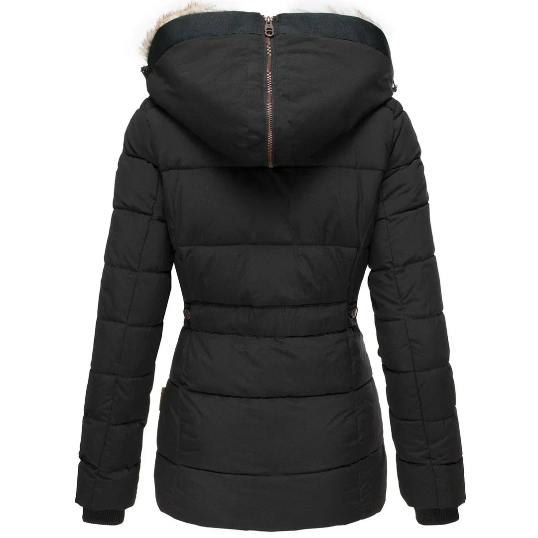 Stylish women's insulated puffer jacket. Elegant cold weather outerwear with a luxurious faux fur hood.