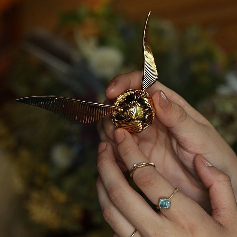 Gift idea: sophisticated gold winged orb movable jewelry case.