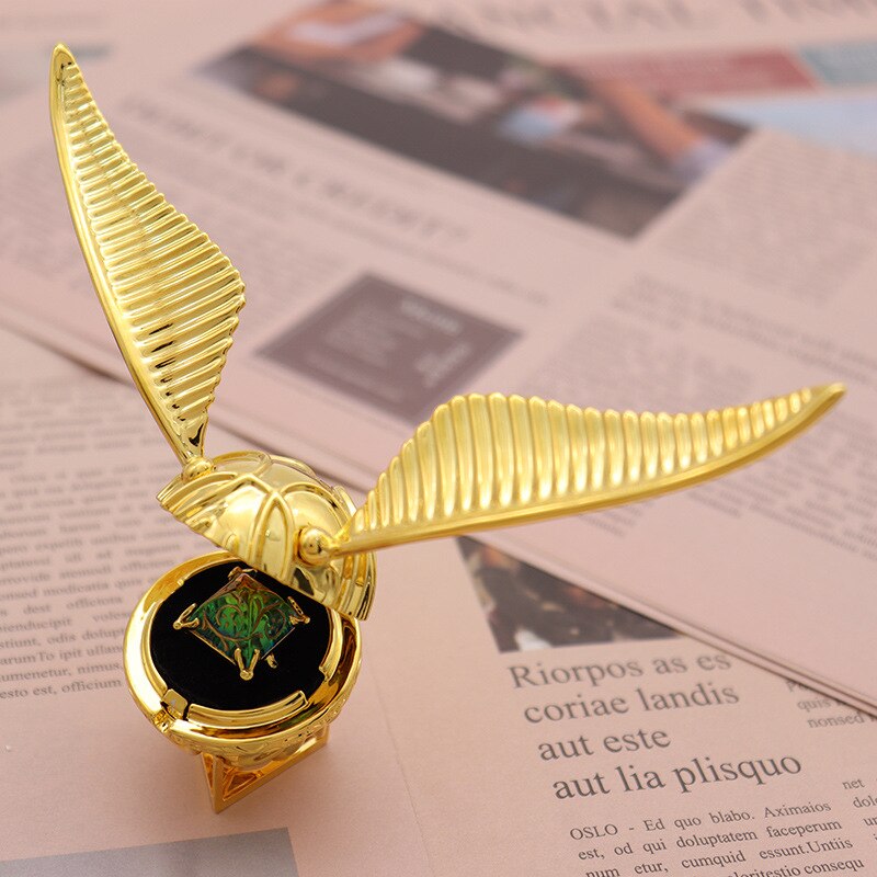 Close-up of the enchanting gold plated winged orb ring box.