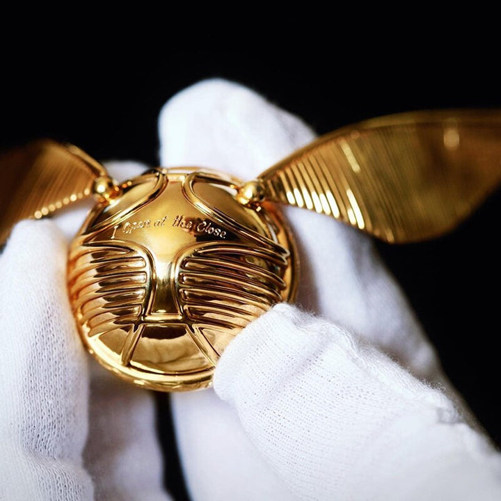 Detailed view of the intricate design on the gold movable jewelry case.