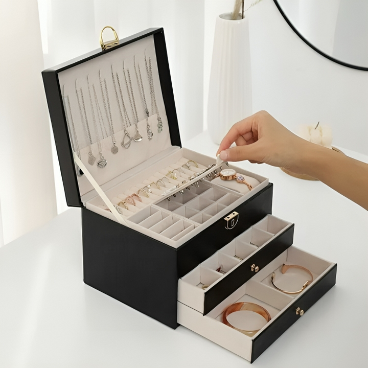 Stylish women's faux leather jewelry box with multi-layer design & drawers for luxury storage of necklaces, rings, and more.