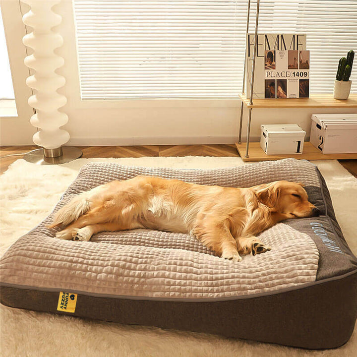 Large grey orthopedic memory foam dog bed with a headrest, perfect for pet support.