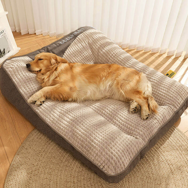 Premium memory foam dog bed, orthopedic support & headrest for canine joint comfort.