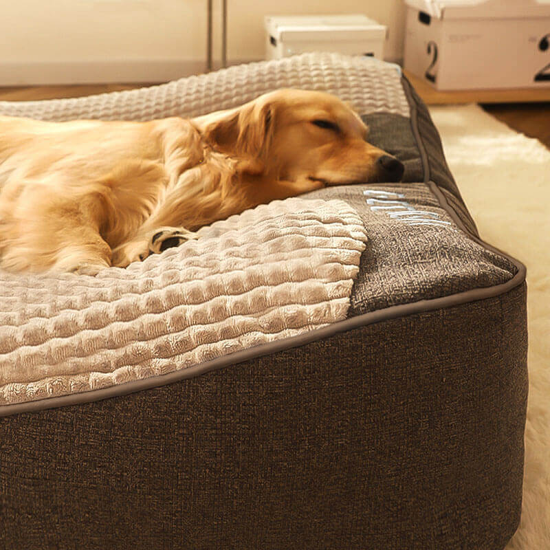 Brown luxury dog bed with headrest, memory foam for pets, featuring a washable cover.