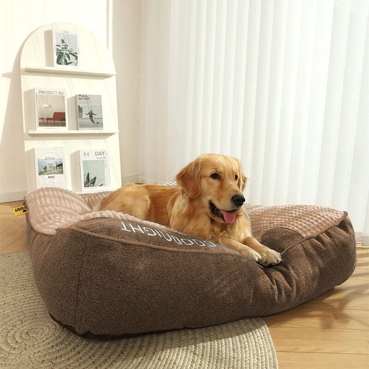 Washable orthopedic memory foam dog bed, headrest included, offering luxurious pet comfort.