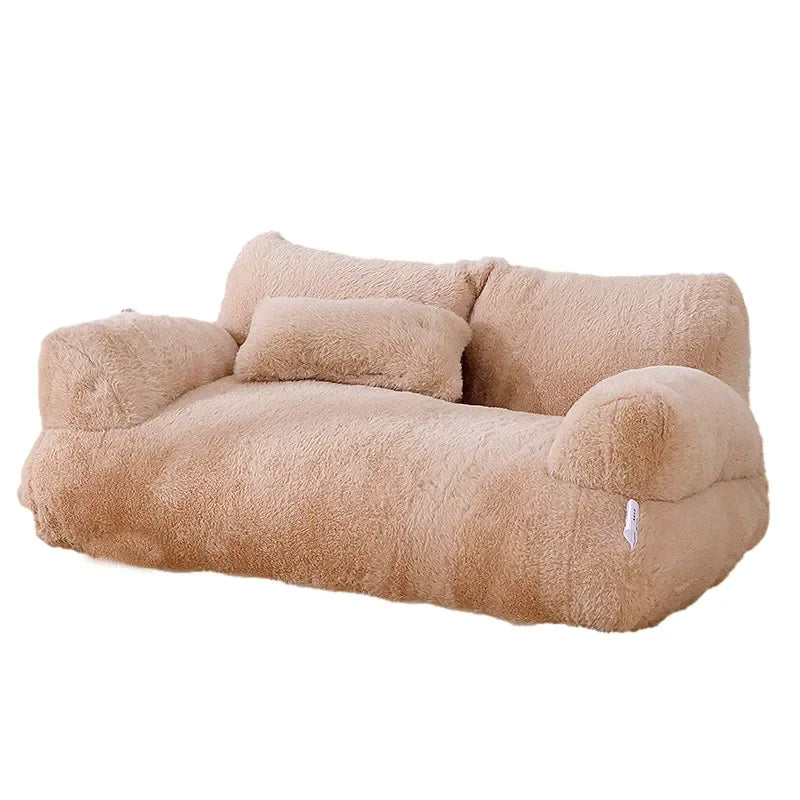 Small dog enjoying a cozy, luxurious plush sofa bed. Washable pet bed for ultimate comfort.