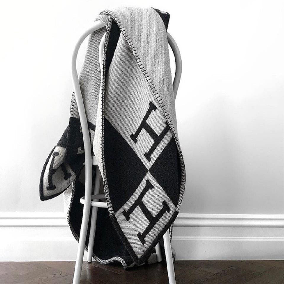A detailed view of the edges and tassels of a handmade wool cashmere throw blanket
