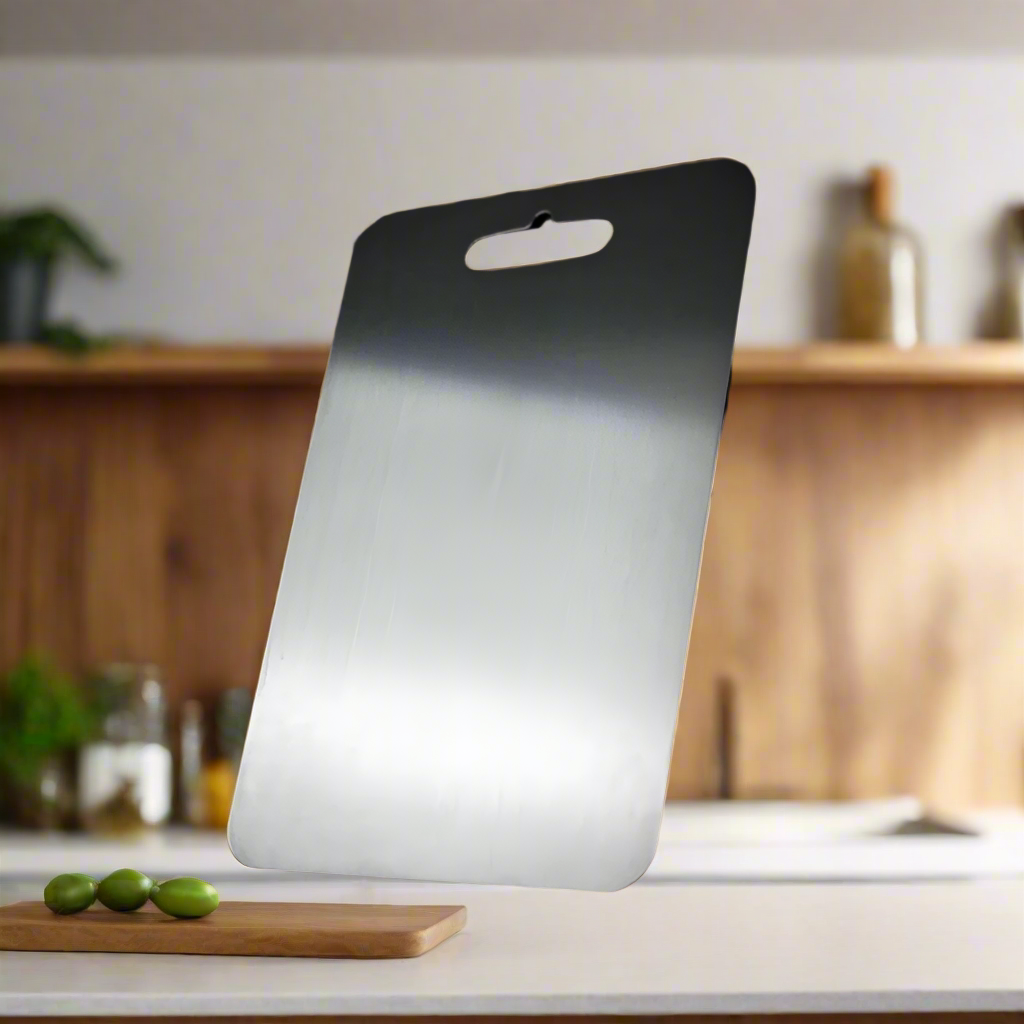 Medical-grade titanium cutting board, non-porous, hygienic for safe food prep.