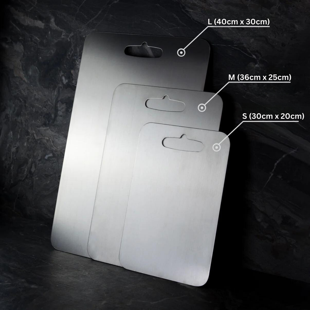 Medical-grade titanium cutting board, non-porous, durable, hygienic, lightweight, chef essential for safe food prep.