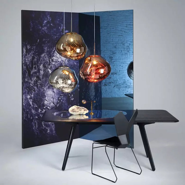 A grouping of Melt pendant lamps in various colors, showcasing design versatility.