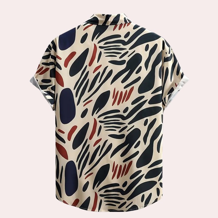 Relaxed fit men's abstract print short sleeve shirt, great for beachwear, vacation outfits, or daywear.