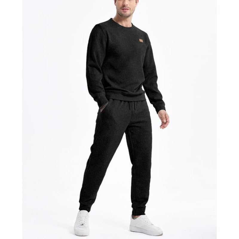 Stylish men's activewear tracksuit set, perfect for workouts or streetwear. Features a cozy top & joggers.