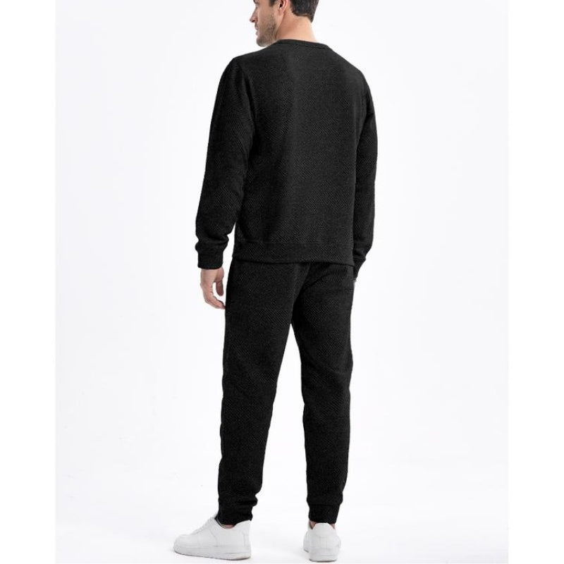 Two-piece men's tracksuit with a drawstring waist, ideal for athletic activities or relaxed casual fashion.