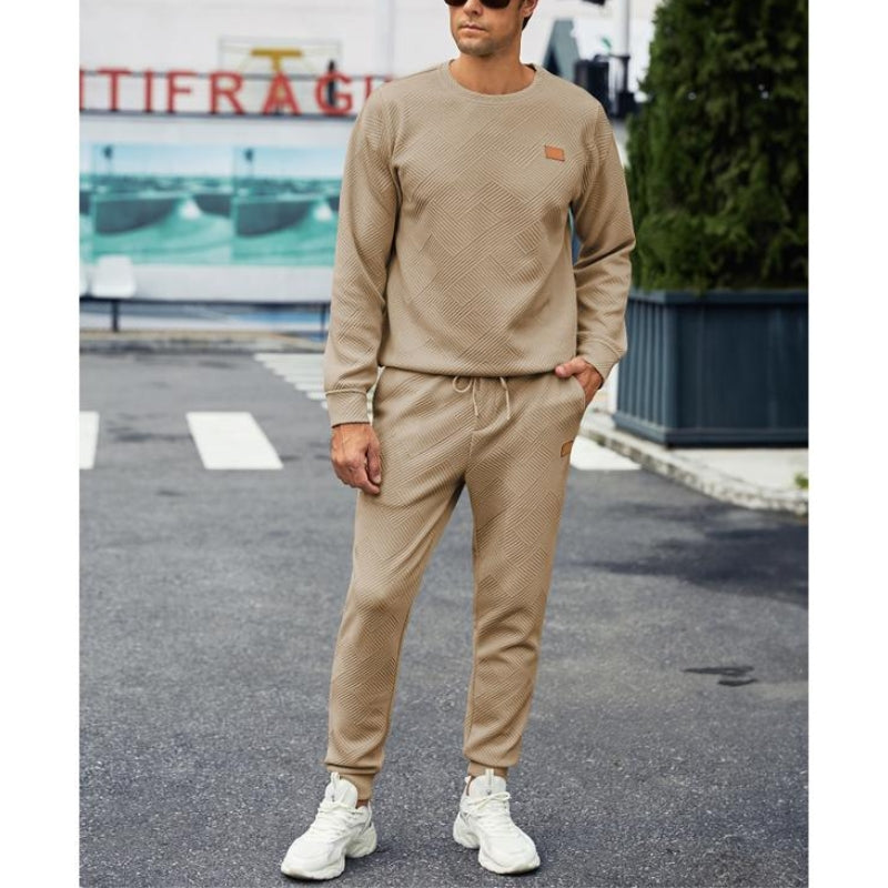 Casual men's tracksuit in a versatile color, featuring a comfy sweatshirt and joggers with a drawstring waist.