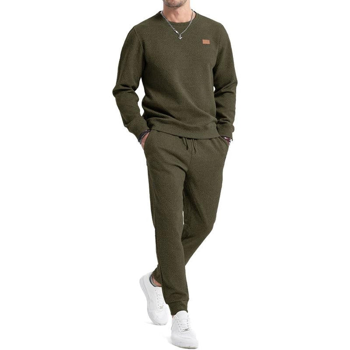 Men's athletic two-piece set, perfect for active lifestyles. Features a relaxed fit sweatshirt and joggers.